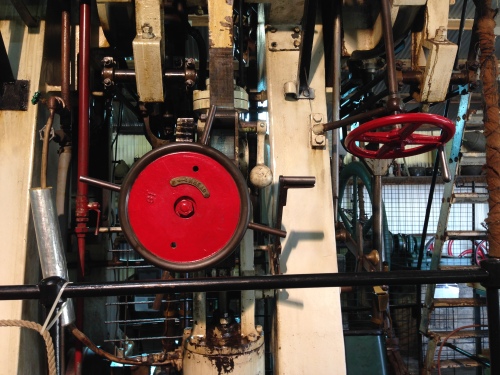 The main steam valve (right), the reversing valve (left front), and the intermediate cylinder start up supply line lever.